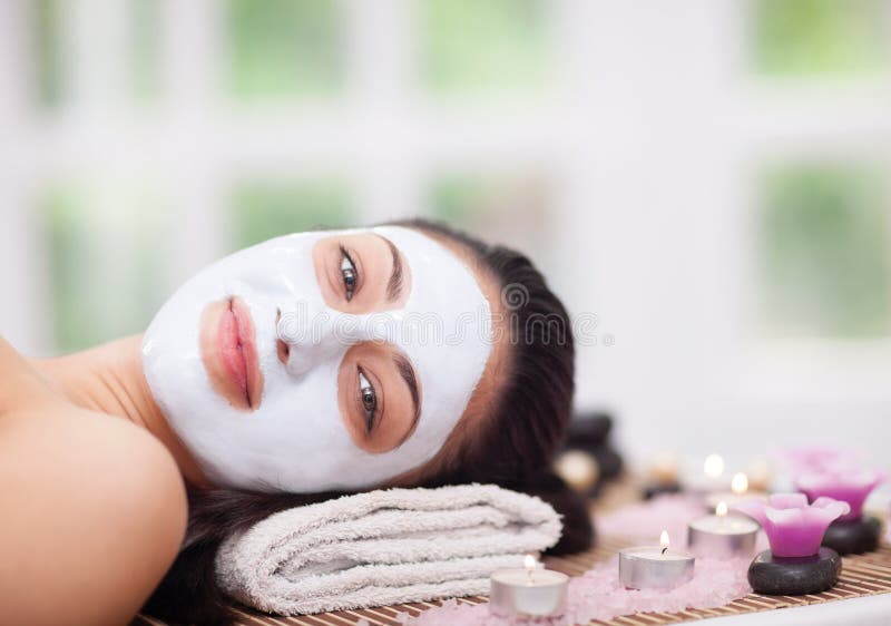 Spa therapy for young woman having facial mask at beauty salon stock images Spa therapy for young woman having facial mask at beauty salon stock images