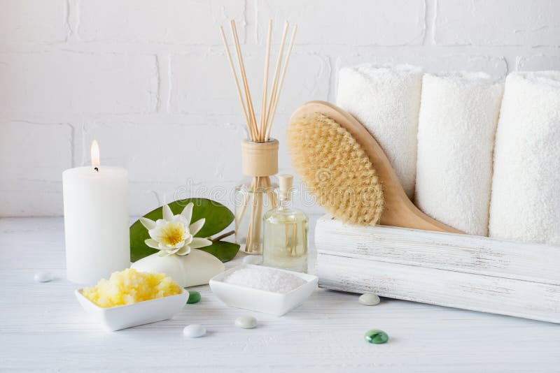 Spa treatment - towels aromatic soap, bath salt, and oil, and accessories for massage