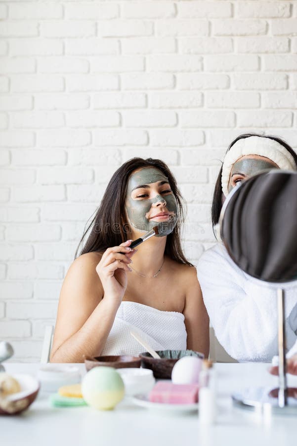 Portrait Of A Beautiful Woman Applying Facial Mask Doing Spa Procedures Stock Image Image Of