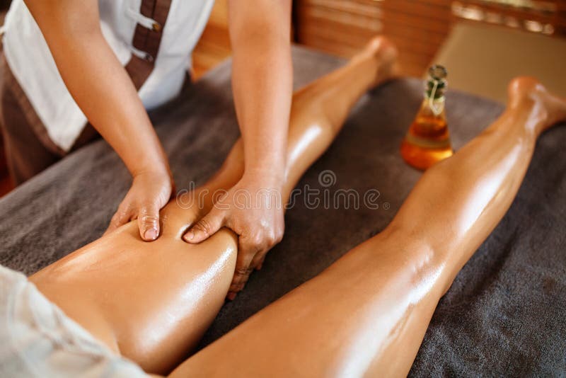 Spa Woman. Oil Leg Massage Therapy, Treatment. Body Skin Care