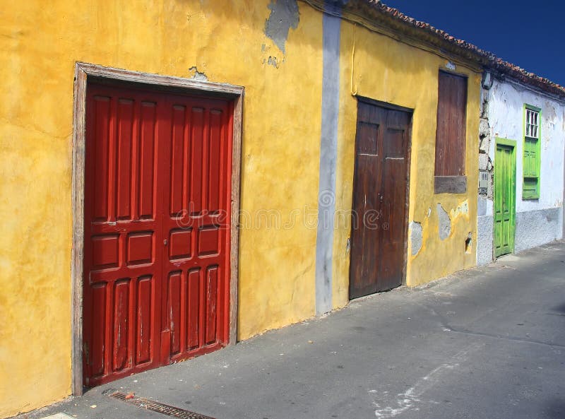 Tropical street with colorful doors. Tropical street with colorful doors.