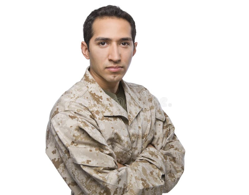 Spaanse Militaire Mens die zich met Gekruiste Wapens bevindt stock foto Spaanse Militaire Mens die zich met Gekruiste Wapens bevindt stock foto