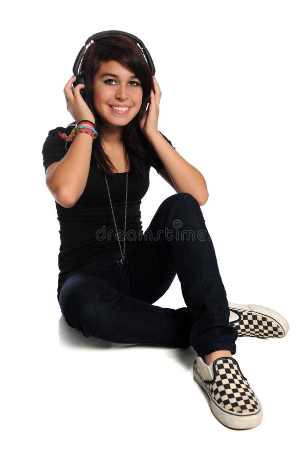 Hispanic teen with headphones isolated over white background. Hispanic teen with headphones isolated over white background