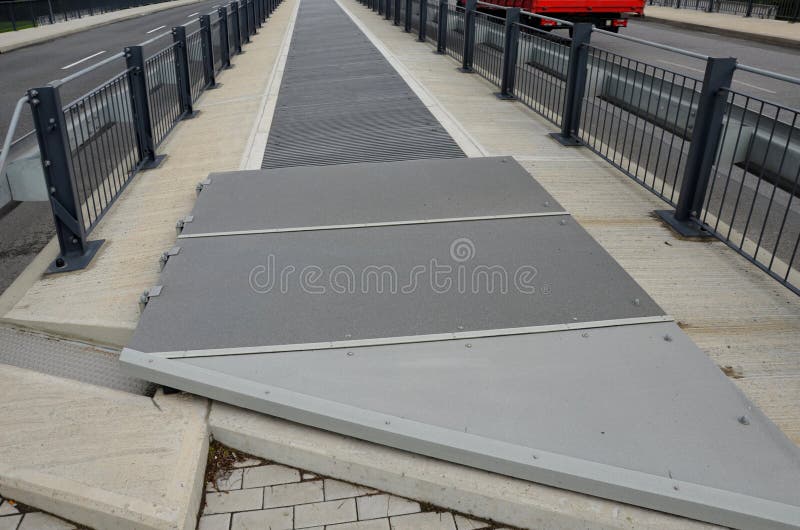 The Space between the Lanes of the Highway Bridge is Blocked by a Grid ...