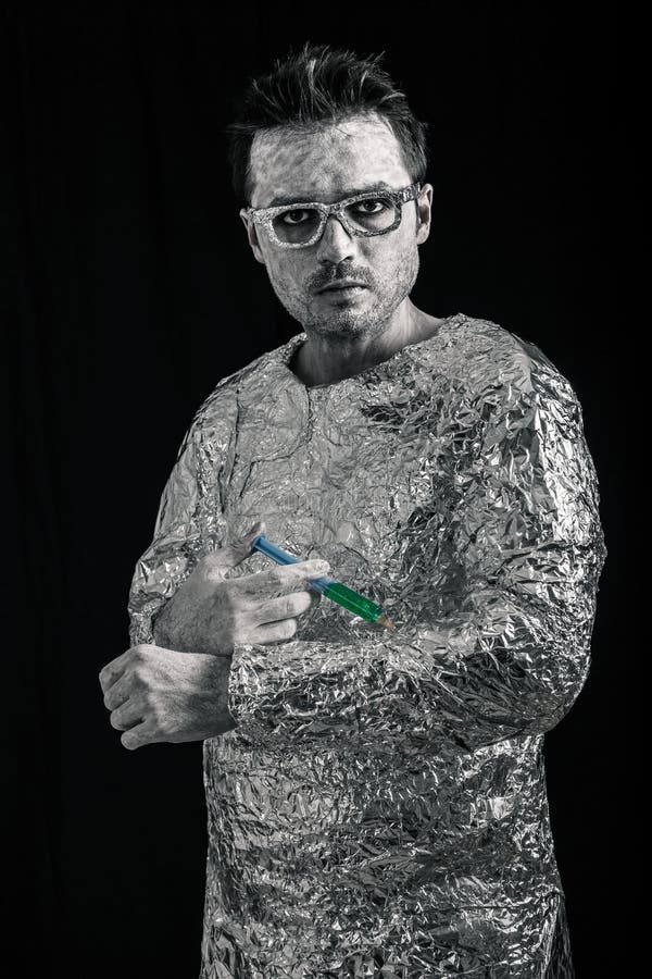 Spaceman applying syringe stock image
