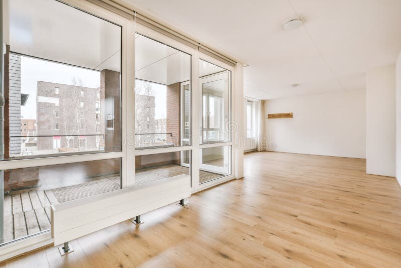 Spacious bright empty room with large windows royalty free stock image