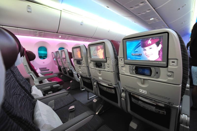 Spacious and comfortable economy class cabin of Qatar Airways Boeing 787-8 Dreamliner at Singapore Airshow