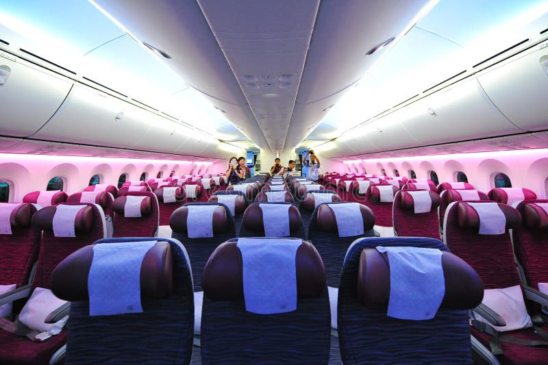 Spacious and comfortable economy class cabin of Qatar Airways Boeing 787-8 Dreamliner at Singapore Airshow