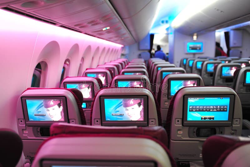 Spacious and comfortable economy class cabin of Qatar Airways Boeing 787-8 Dreamliner at Singapore Airshow