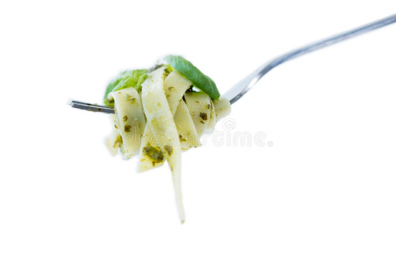 Close-up of spaghett rolled up in fork against white background. Italian pasta spaghett stock images, royalty-free photos and pictures