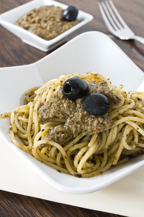 Spaghetti with Black Olive Pesto. Stock Image Image of cutlery