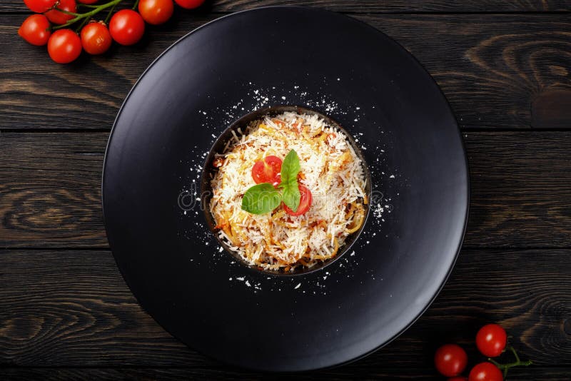 Spaghetti Bolognese on Black Plate Stock Image Image of olive