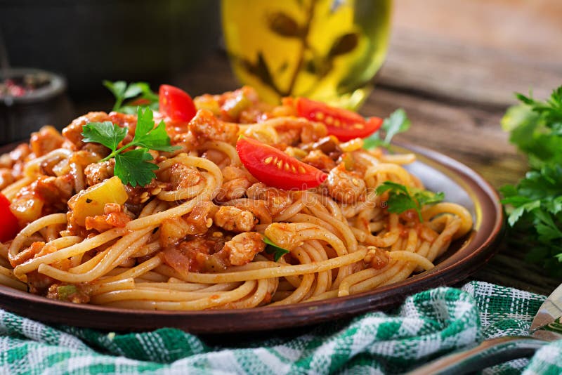 Spaghetti bolognese pasta with tomato sauce, vegetables and minced meat