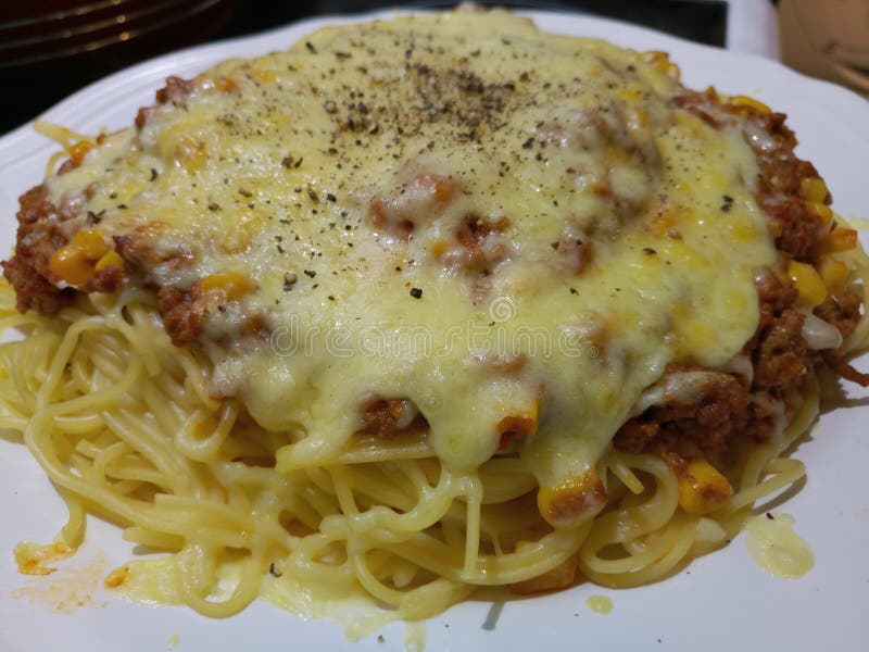 Spaghetti Bolognese with a Thick Layer of Cheddar Cheese Stock Image
