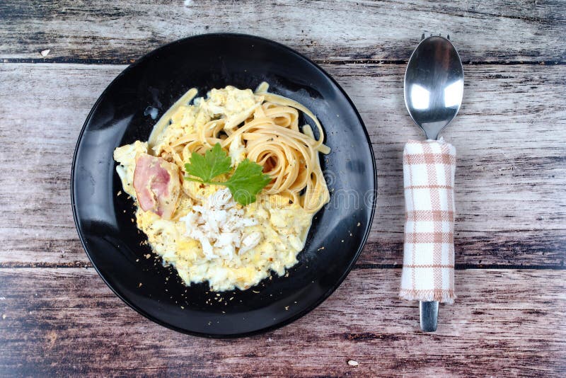 Spaghetti Carbonara with Crab, Black Dish. Stock Photo Image of
