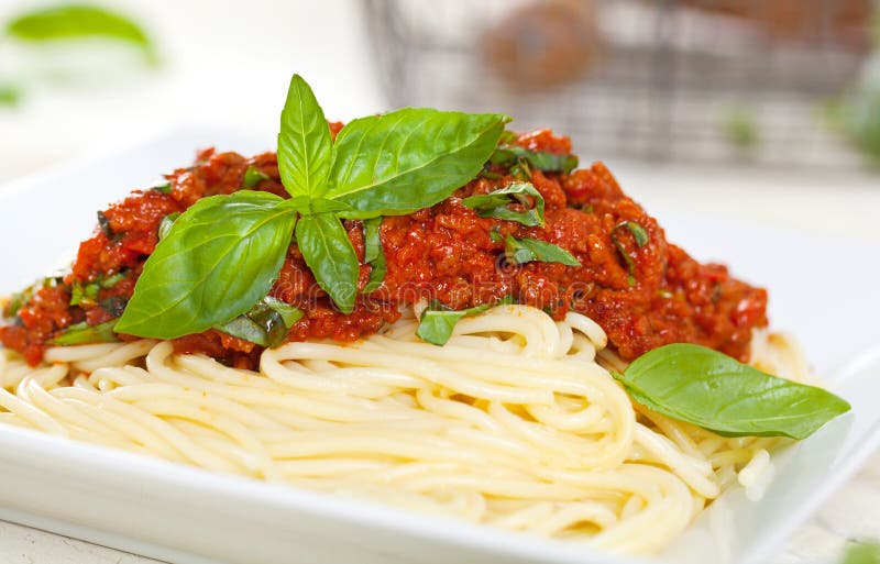 Spaghetti Dinner with Meat Sauce and Basil Close Up Bolognese. Stock