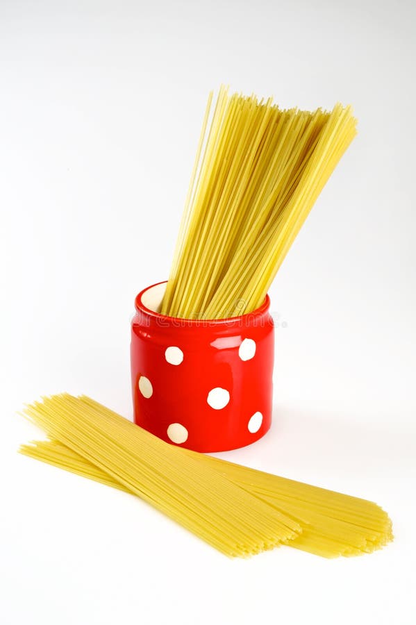 Spaghetti inside a red jar stock image. Image of uncooked 20841345