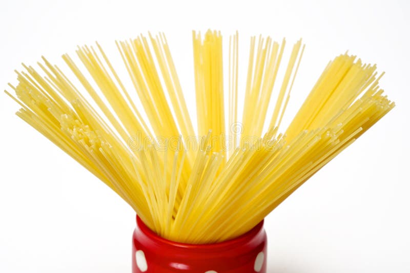 Spaghetti inside a red jar stock image. Image of uncooked 20841345