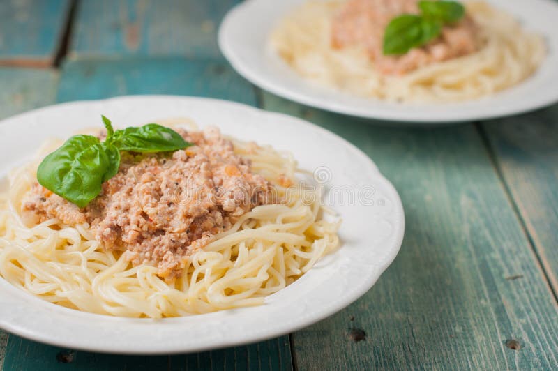 Spaghetti with meat sauce on blue background stock photography Spaghetti with meat sauce on blue background stock photography