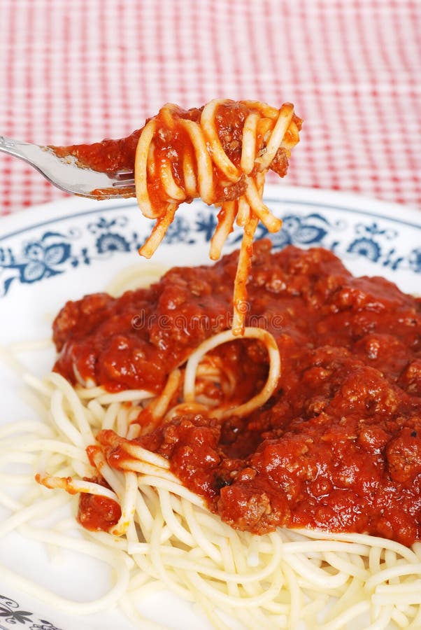 Spaghetti and meat sauce on a fork