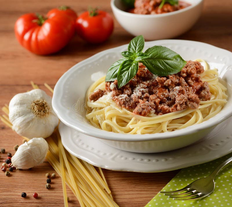 Spaghetti with Meat Sauce with Ingredients Around Stock Photo Image