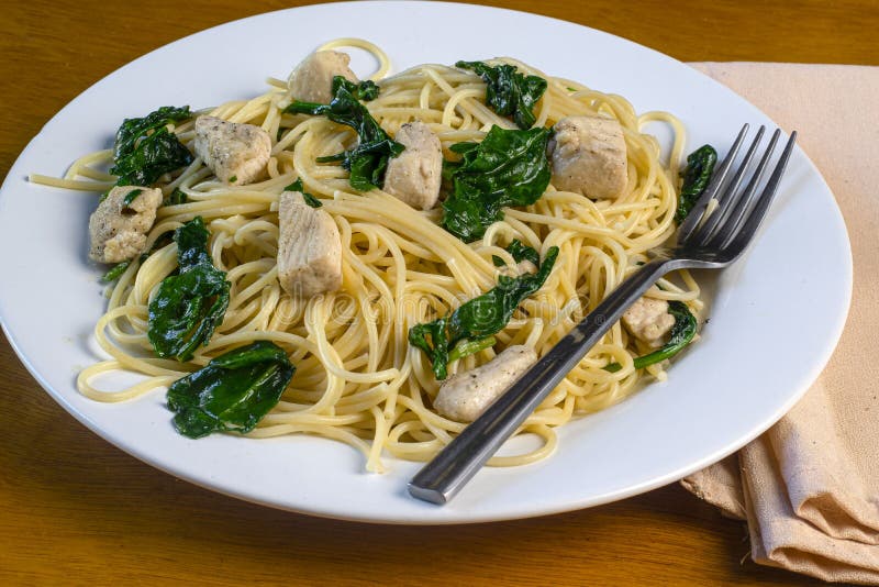 Spaghetti Top with Sauteed Spinach and Chicken Stock Image Image of