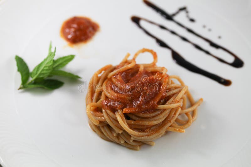Spaghetti with tomato basil and mint typical Italian dish italy