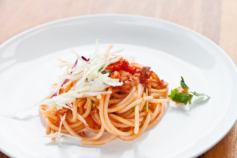 Delicious Risotto on the Black Ceramic Plate Topped with Shaved Cheese