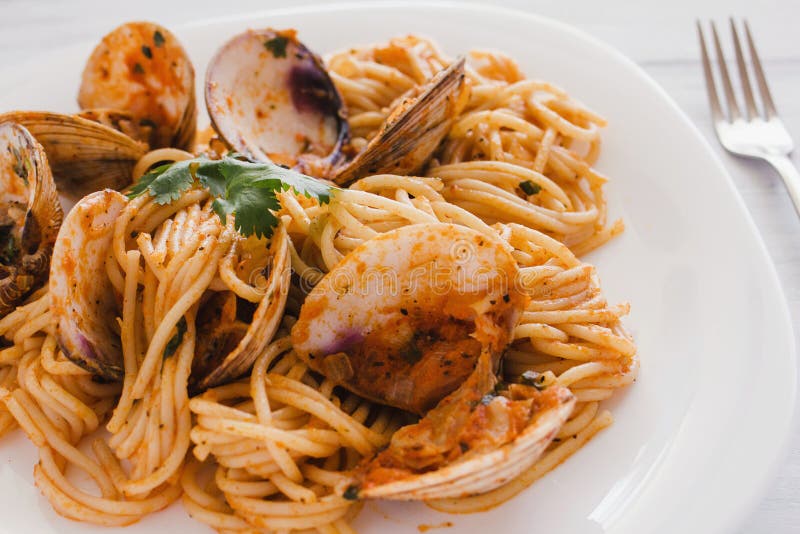 Spaghetti z milczkami i pomidorowym kumberlandem, spaghetti Vongole zdjęcie royalty free Spaghetti z milczkami i pomidorowym kumberlandem, spaghetti Vongole zdjęcie royalty free
