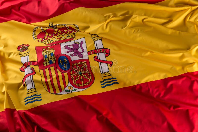 Spain Flag of Silk. Spanish National Colours with Emblem Stock Photo