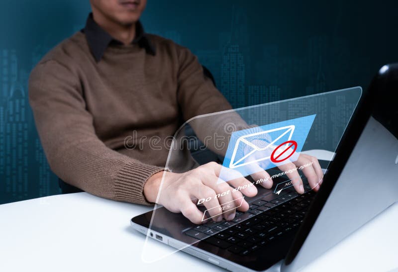 Spam e-mail blocking, phishing email warning pop-up, network security concept At home, a businesswoman works on her laptop