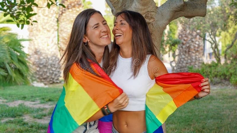 Spanish Lesbian Couple Posing With A Pride Flag Stock Image Image Of