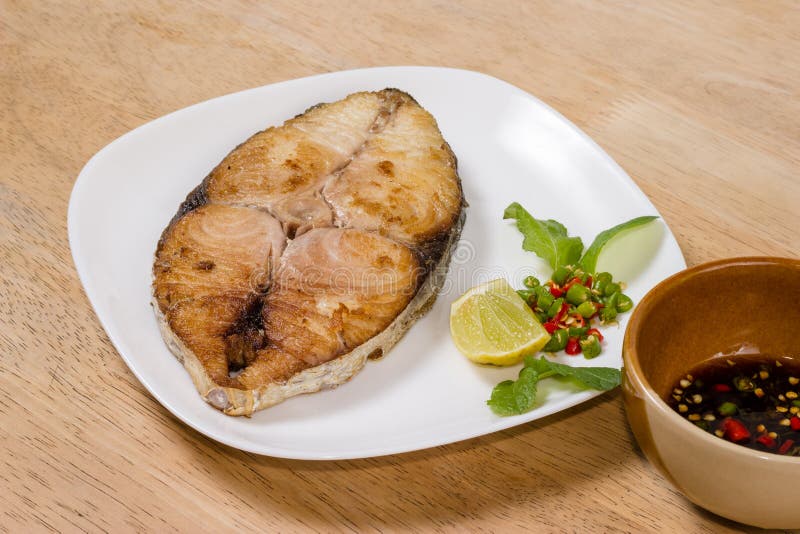 Spanish Mackerel Steak on Wood Background,fried Fish Stock Photo