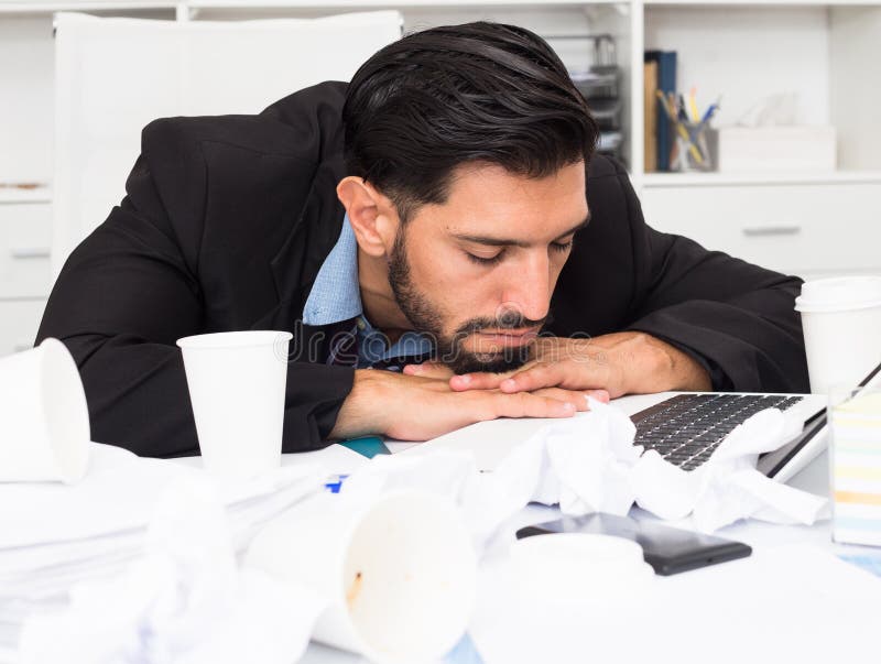 Spanish Man is Sleeping at Desk after Productive Day Stock Photo