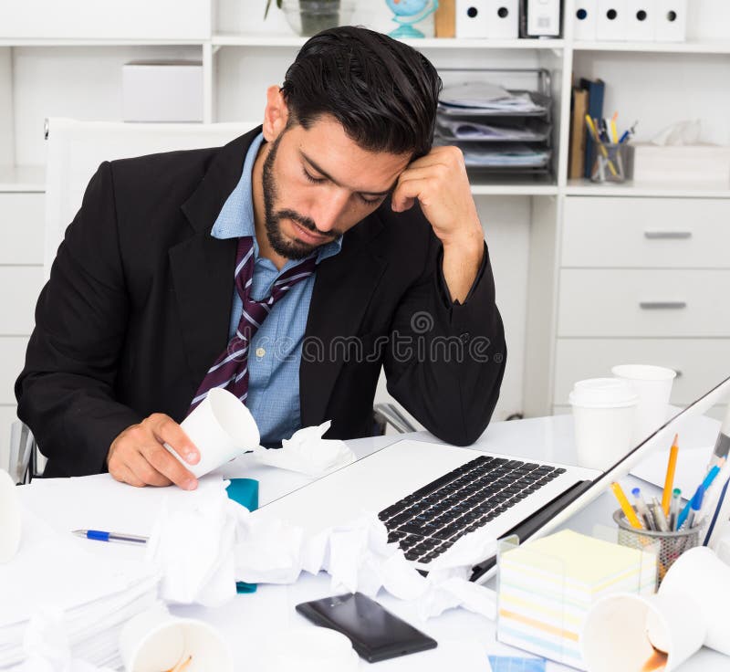 Spanish Man is Sleeping at Desk after Productive Day Stock Photo