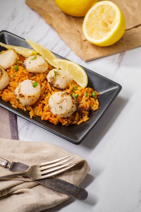 Spanish Rice Lemon Scallops Stock Photo Image of pilaf, eating 134850212