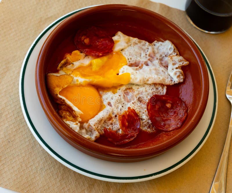 Spanish Tapas with Chorizo Sausage and Tomato Paste Closeup Stock Photo
