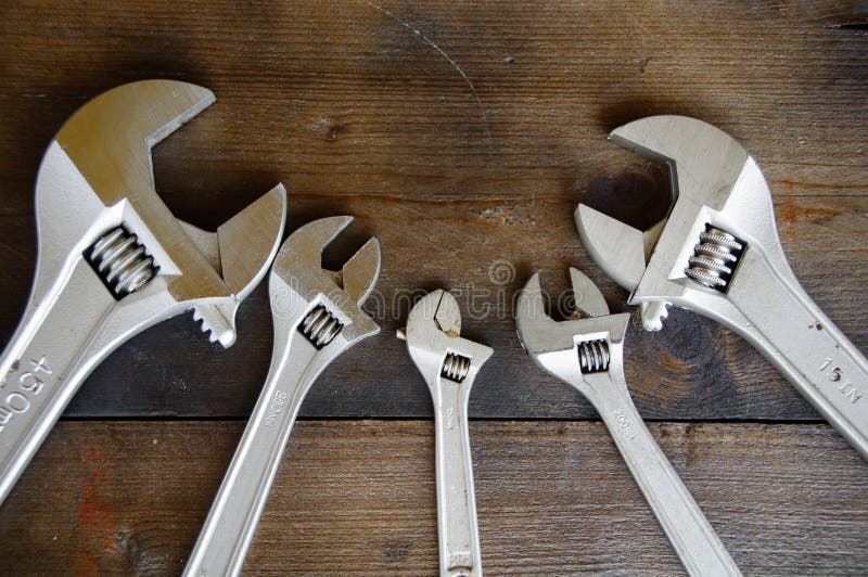 Spanner or adjustable wrench on wooden back ground, Basic hand tools