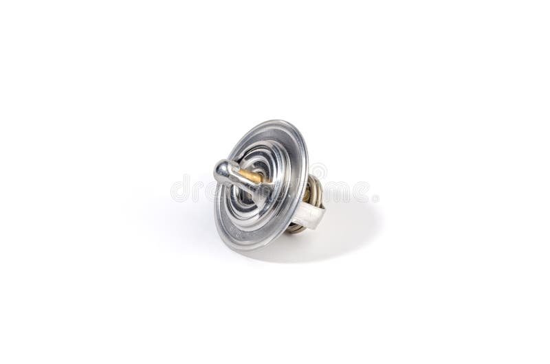 New Car Thermostat on a White Isolated Background Next To a Rubber Gasket. Repair Kit of Spare