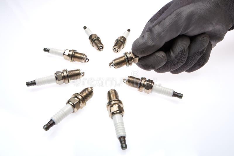 4 Spark Plugs with a Magnifying Glass Stock Image Image of assembly