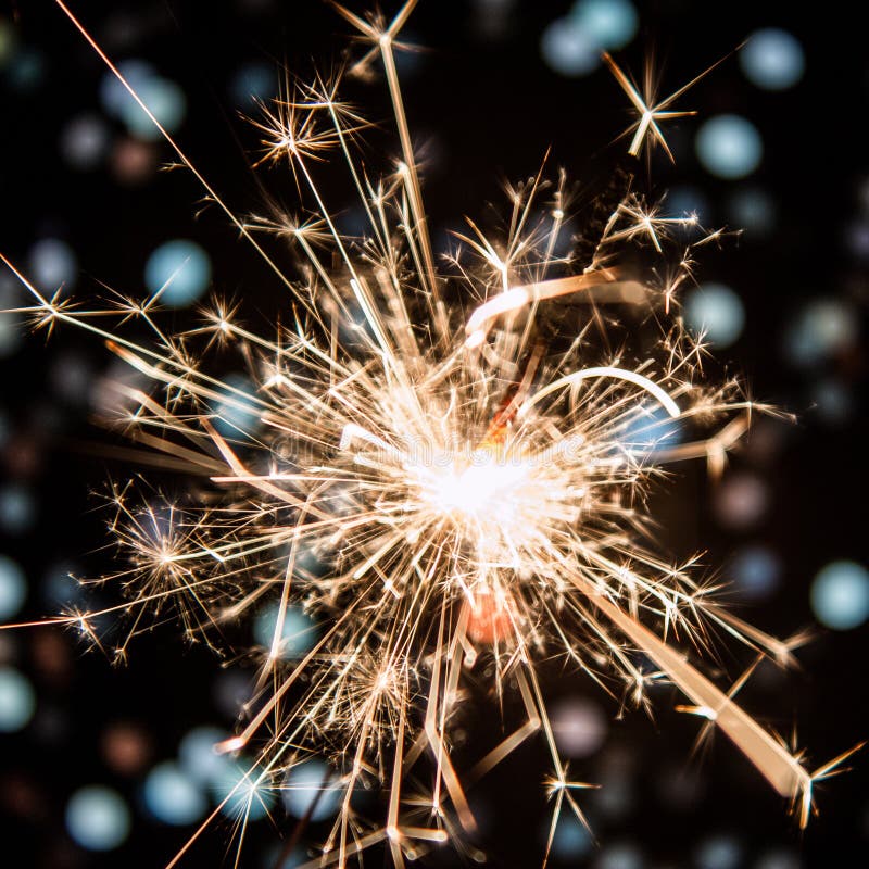 Sparkler with bokeh background stock image Sparkler with bokeh background stock image