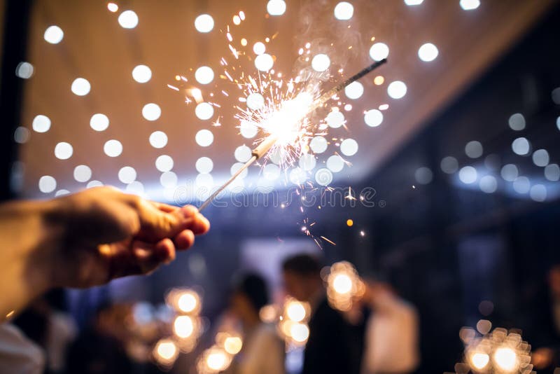 Sparkler burns in hand.happy new year 2022