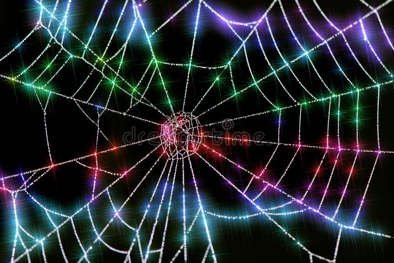 Close up of colorful sparkling dew drops on a spider web. Close up of colorful sparkling dew drops on a spider web.