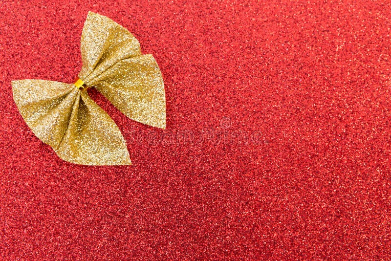 Sparkling golden ribbon on red glitter background royalty free stock image Sparkling golden ribbon on red glitter background royalty free stock image