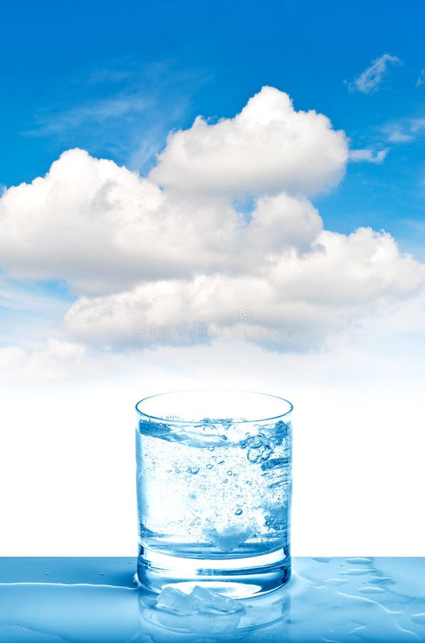 Sparkling water glass on blue sky Fresh cold drink