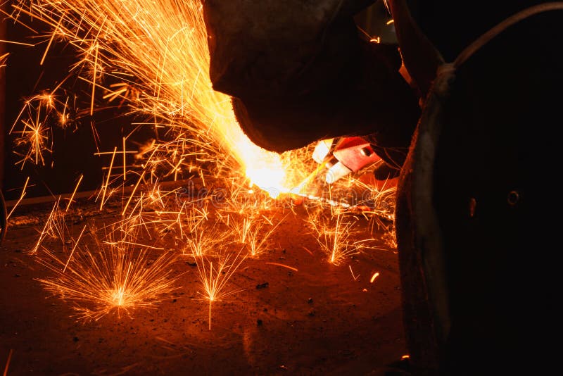 Sparks and smoke from Welder arc Gouging carbon