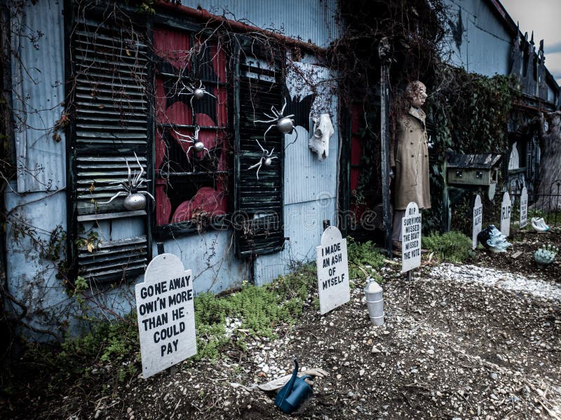 Funny Halloween decorations in front of a haunted house