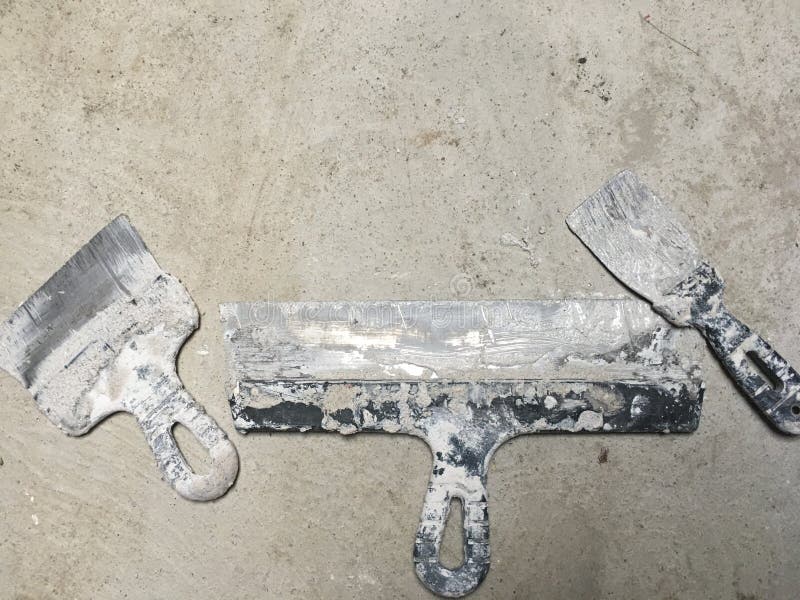 Spatulas and Buckets for Plastering Walls. a Working Tool during the