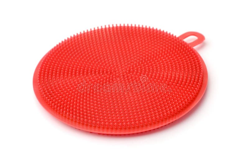 Spazzola rossa di lavaggio del piatto del silicone fotografia stock libera da diritti Spazzola rossa di lavaggio del piatto del silicone fotografia stock libera da diritti
