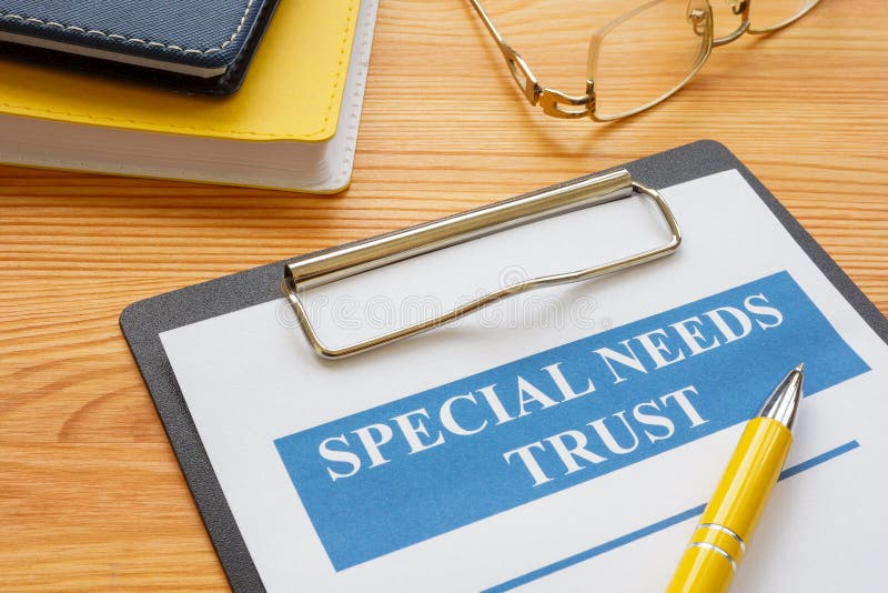 Special needs trust application with clipboard and note. royalty free stock images